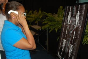 The public is using 3D glasses to see the 3D in the anaglyph photos of the head, front and back of the body, during presentation and expositions.